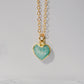 Natural blue green Amazonite gemstone pendant set on a 14k gold filled chain. The stone is a faceted heart shape and bezeled in 22k gold electroplate.