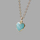 Natural blue green Amazonite gemstone pendant set on a 14k gold filled chain. The stone is a faceted heart shapr and bezeled in 22k gold electroplate.
