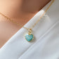 Natural blue green Amazonite gemstone pendant set on a 14k gold filled chain. The stone is a faceted heart shape and bezeled in 22k gold electroplate.