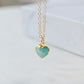 Natural blue green Amazonite gemstone pendant set on a 14k gold filled chain. The stone is a faceted heart shape and bezeled in 22k gold electroplate.