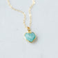 Natural blue green Amazonite gemstone pendant set on a 14k gold filled chain. The stone is a faceted heart shape and bezeled in 22k gold electroplate.