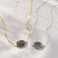 Genuine raw black sunstone gemstone set on a sterling silver or gold filled chain. The shape of the stone is irregular.