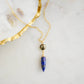 This necklace is handmade with natural pyrite and lapis lazuli suspended from a 14k gold filled or sterling silver chain.