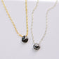 Genuine tiny snowflake obsidian necklaces in gold or silver. The gemstone is a small faceted teardrop.