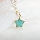 Dainty, natural aqua amazonite celestial stone star pendant set on a 14k gold filled chain. This image is a close up of the gemstone's natural aqua-blue color. This necklace is a great gift for night sky lovers, girlfriends, mom, wife, or daughter.
