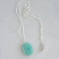 Bright aqua blue Amazonite stone cut into a thin, polished slice with raw edges, then set onto a sterling silver beaded chain.