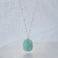 Bright aqua blue Amazonite stone cut into a thin, polished slice with raw edges, then set onto a sterling silver beaded chain.