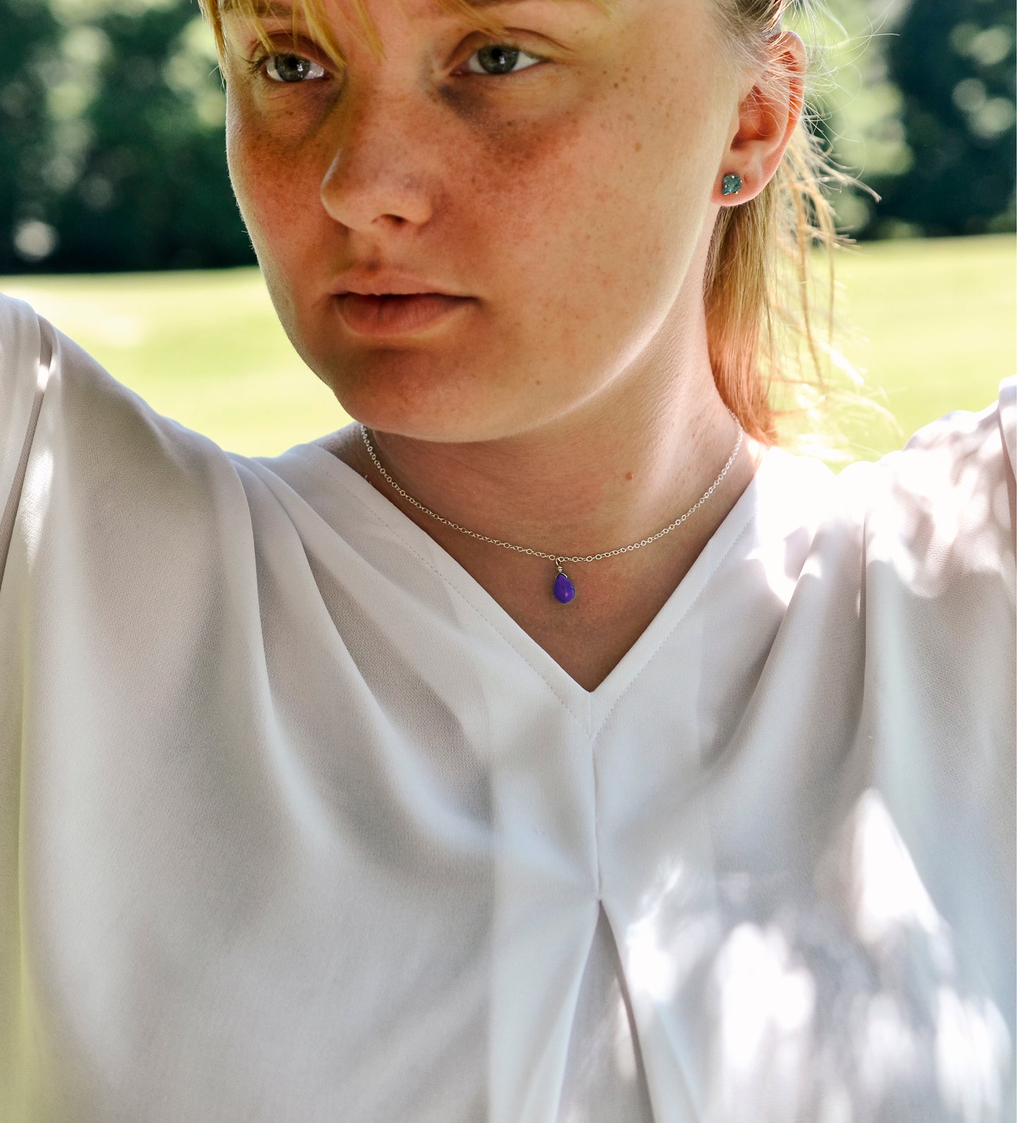 Modeled image of purple Amethyst droplet necklace. Shown in Sterling Silver.