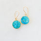 Real turquoise gemstones set in gold vermeil bezels and suspended from 14k gold filled ear wires. These handmade earrings feature smooth polished round stones. Artisan jewelry from Connecticut by GEMNIA.