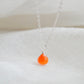 A real, real orange Carnelian stone teardrop pendant suspended from a sterling silver cable chain. This necklace is handmade and also comes in 14k gold filled. The crystal is faceted and varies in shades of orange to red.