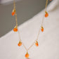 Handmade necklace featuring nine natural Carnelian gemstones set onto a gold filled chain. Sterling Silver is also available. 
