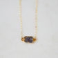 Handmade necklace with a dark gray quartz druzy gemstone pendant on a 14k gold filled chain.