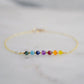 A minimalist chakra bracelet handmade with tiny natural crystals in the order of the rainbow. The chain is 14k gold filled or sterling silver. 
