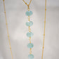 Genuine aqua blue Apatite gemstones set onto a beaded gold chain.