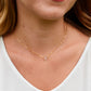 A clear, natural crystal quartz faceted teardrop set onto a 14k gold filled chain. Modeled image.