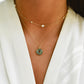 A labradorite pendant layered with a pearl chain necklace in 14k gold filled. Handmade dainty gemstone jewelry.
