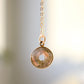 A genuine smooth polished labradorite pendant necklace set on a 14k gold filled cable chain.
