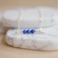 Three genuine Lapis Lazuli stones set onto a sterling silver chain. Handmade Jewelry by GEMNIA.