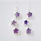 Sterling silver celestial amethyst star earring jewelry. Each earring features three purple amethyst stars dangling from a sterling silver chain.