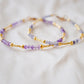 Handmade beaded gemstone crystal bracelet in gold filled or sterling silver. These bracelets feature a gemstone of your choice on a bracelet that can be stacked with others or worn alone. Modeled image showing: tanzanite, amethyst