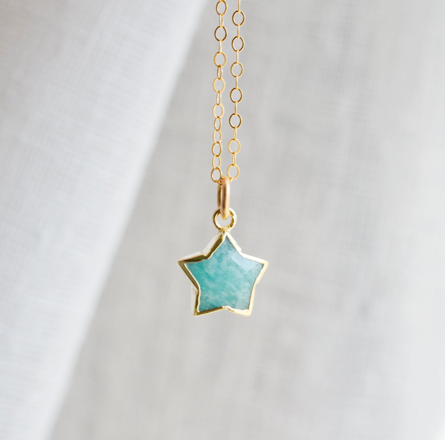 Dainty, natural aqua amazonite celestial stone star pendant set on a 14k gold filled chain. This necklace is a great gift for stargazers, girlfriends, mom, wife, or daughter.
