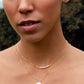 Modeled image of white freshwater pearl bar necklace shown in 14k gold filled. The peals are small and slightly irregular in shape.