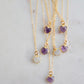 Natural purple amethyst heart stone pendant set onto a gold chain necklace. Shown with rainbow moonstone hearts.