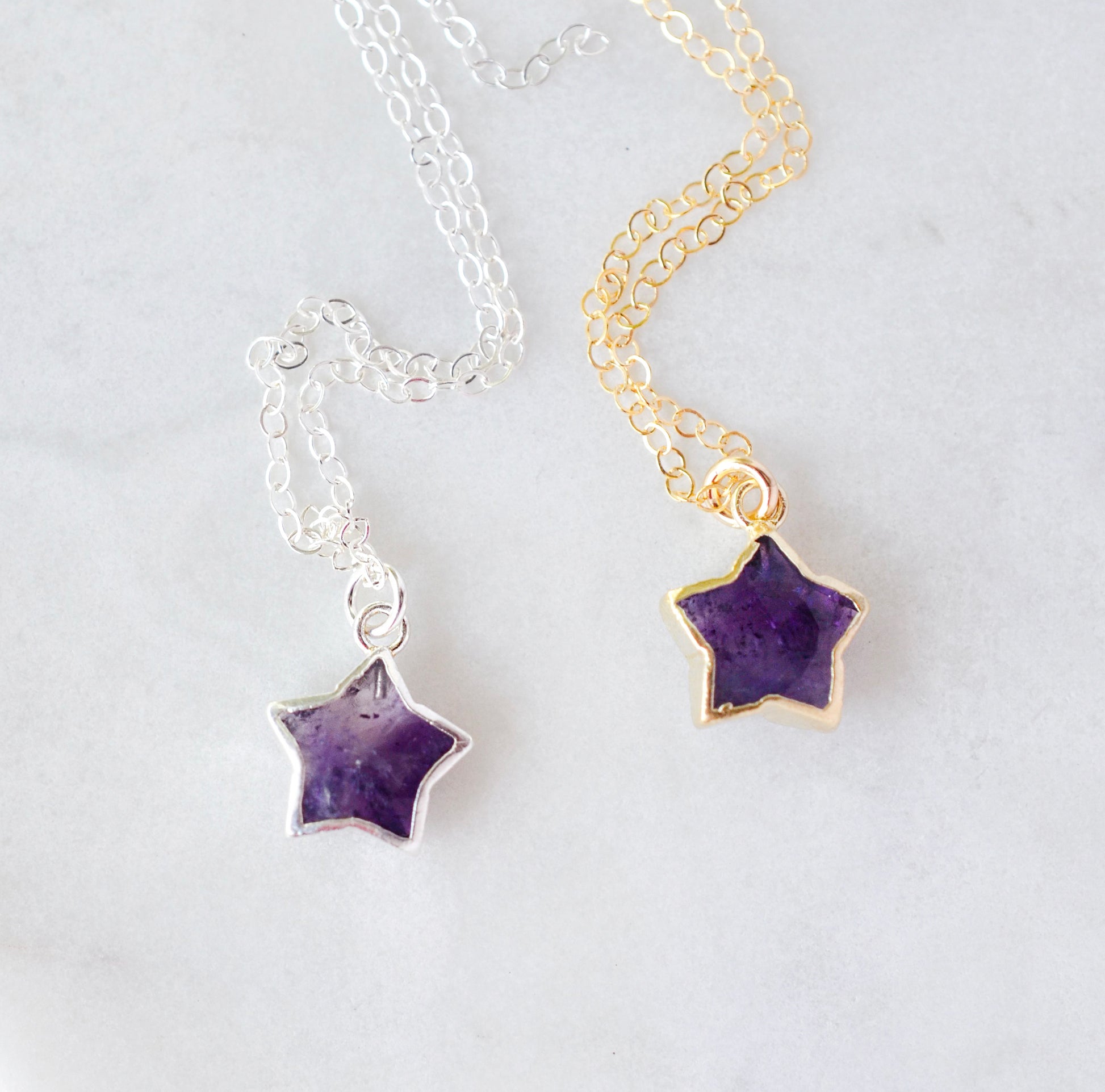 Small natural purple amethyst star pendants shown on sterling silver and 14k gold filled chains.
