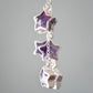 Sterling silver celestial amethyst star earring jewelry. Each earring features three purple amethyst stars dangling from a sterling silver chain. Close up image.
