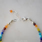 Tiny gemstone beaded bracelet in rainbow colors. Colors include: blue, green, yellow, red, orange, and purple.