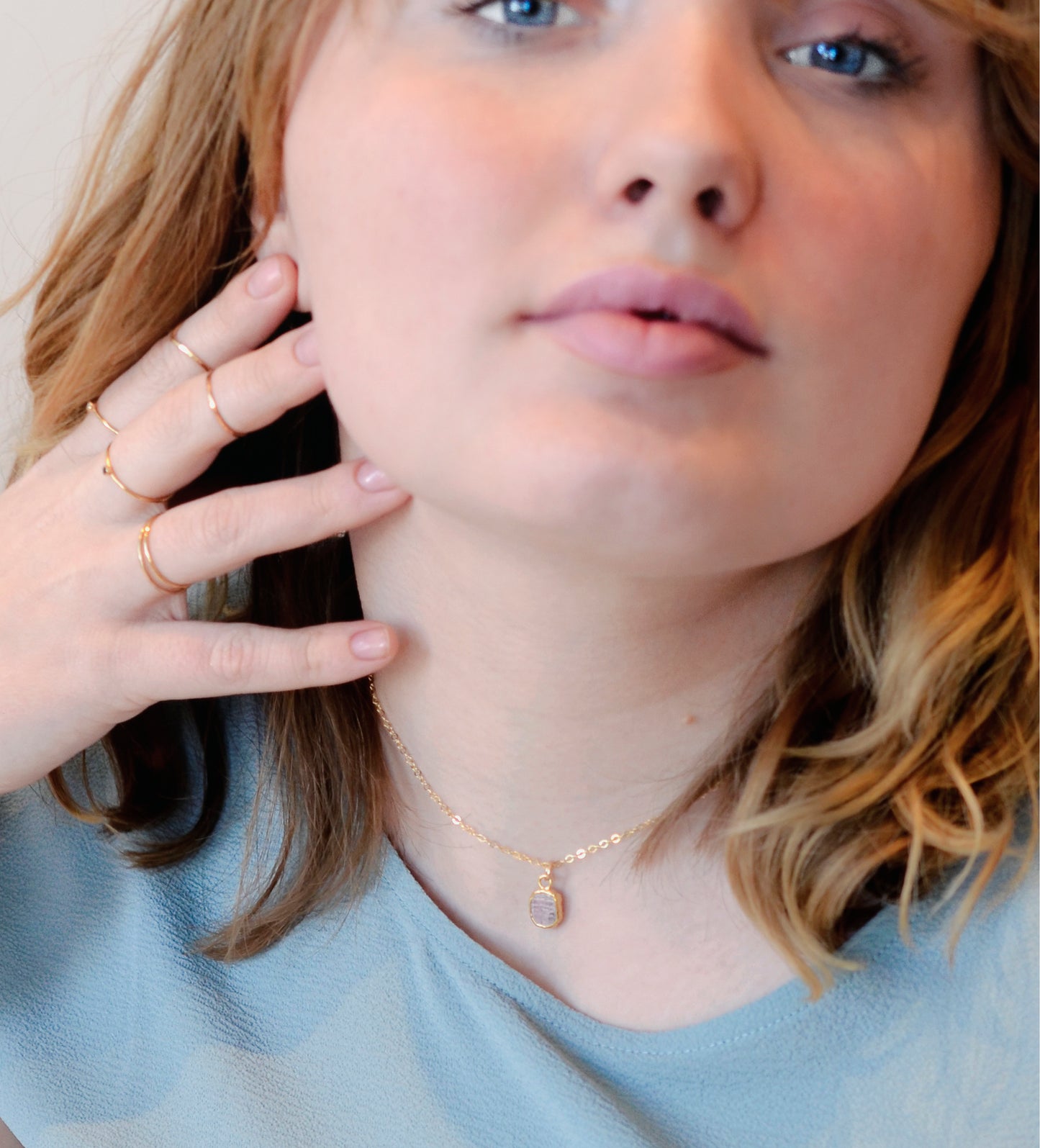 Small pink Rhodochrosite gemstone set in gold. Modeled image.