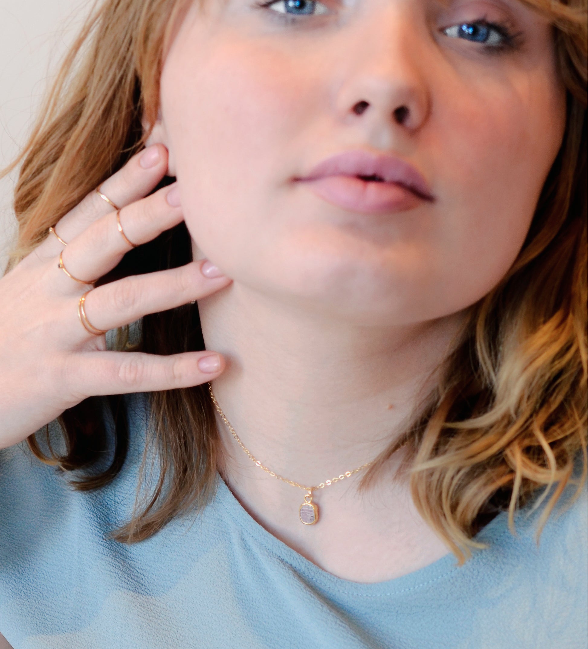 Small pink Rhodochrosite gemstone set in gold. Modeled image.