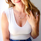 Modeled image in a sterling silver style. A multi-color minimalist genuine jade necklace featuring seven round green, brown, yellow, or blue natural stones. Handmade in New England by Gemnia Jewelry.