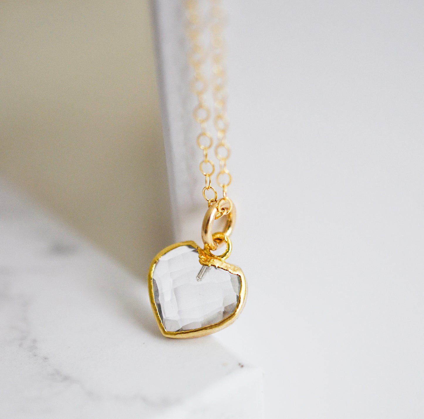 clear quartz gemstone in a heart shape on a 14k gold filled chain. Perfect romantic gift for Valentine's Day, mom, wife, girlfriend, or friend.