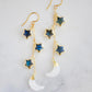These handmade earrings feature genuine labradorite stars atop rainbow moonstone crescent moons. These dangles are long but lightweight. Shown in gold, but also available in sterling silver.