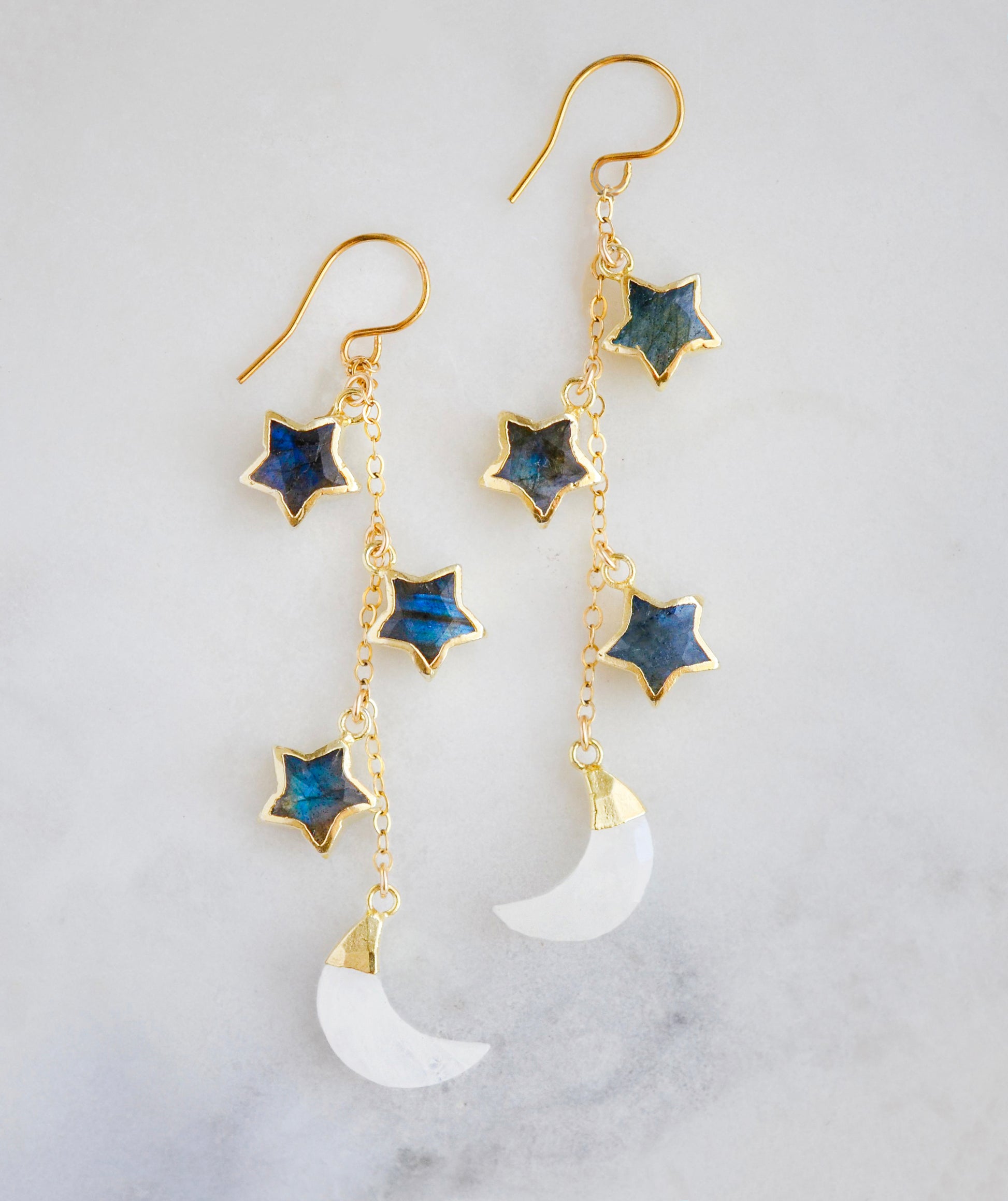 These handmade earrings feature genuine labradorite stars atop rainbow moonstone crescent moons. These dangles are long but lightweight. Shown in gold, but also available in sterling silver.