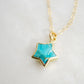 Natural blue turquoise star pendant on a 14k gold filled chain. Close up image.