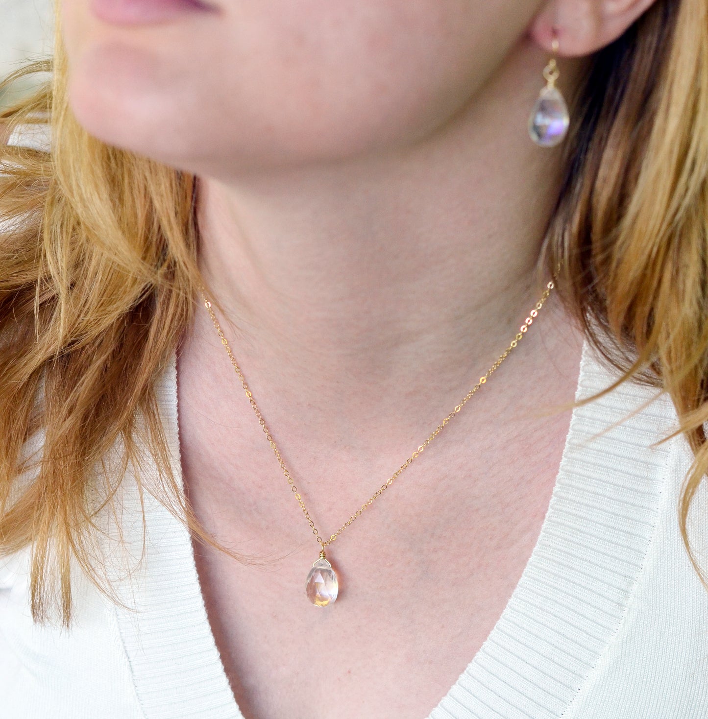 Modeled image of the mystic Topaz necklace worn with the matching teardrop earrings. Shown in 14k gold filled.