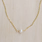 Single round white freshwater pearl necklace on a 14k gold filled chain.