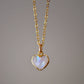 Natural rainbow moonstone heart pendant set onto a sterling silver or gold filled chain. Small stone heart pendant. 
