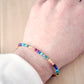 Mulit color beaded gemstone bracelet. Rainbow, pride delicate bracelet handmade with turquoise, apatite, emerald, garnet, yellow opal, amethyst, aventurine, and lapis lazuli. 