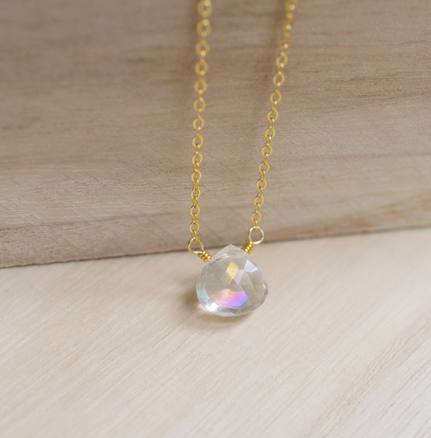 Close up of the rainbow colors in the Mystic Topaz crystal. The 14k gold filled style is shown.