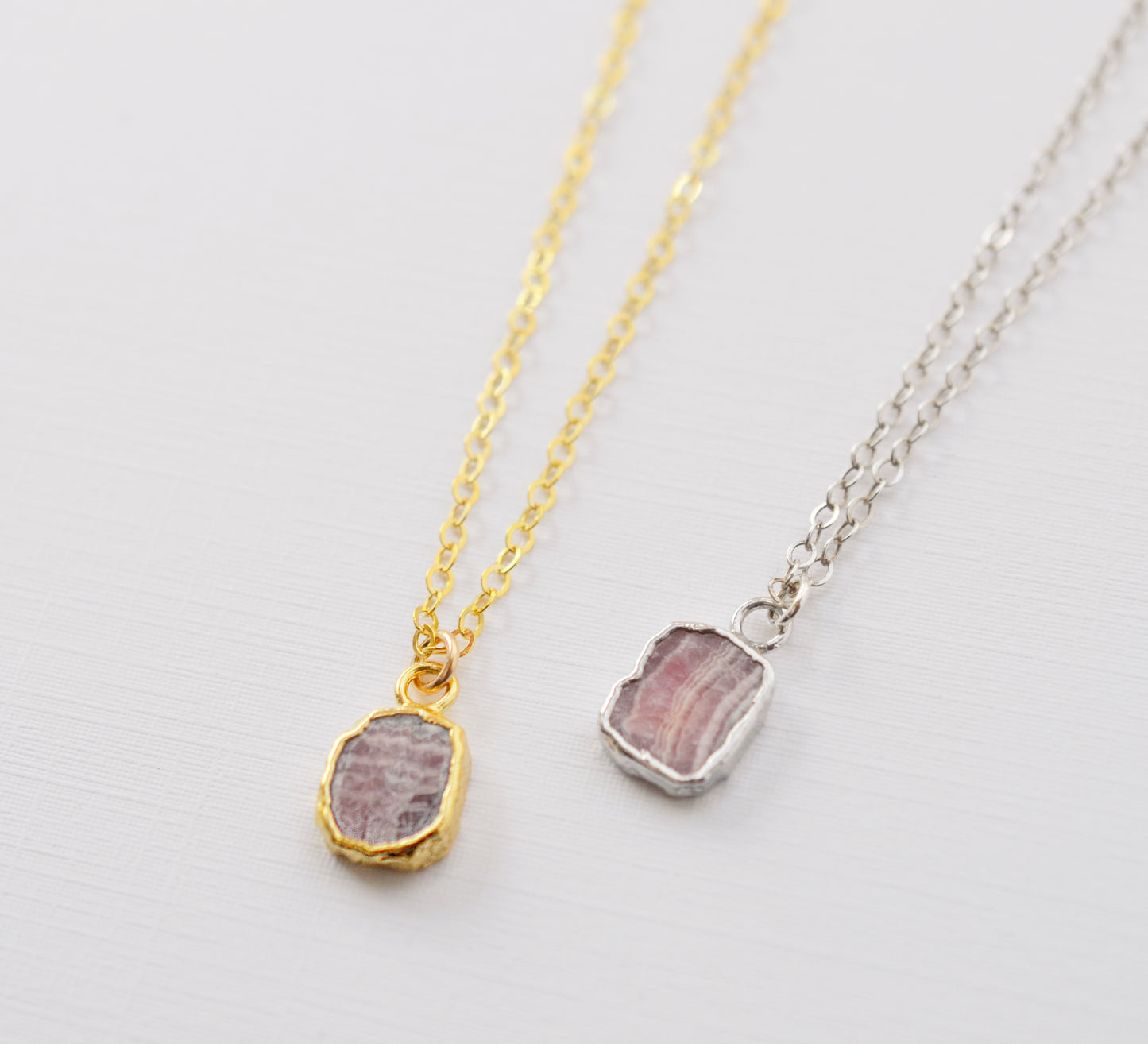 Pale pink Rhodochrosite smooth polished slice set in gold or silver.