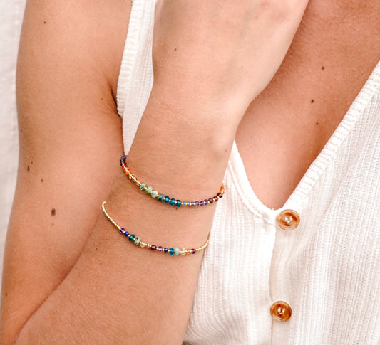 Handmade real gemstone bracelet for the Chakras or Pride. Stones include: Garnet, amethyst, topaz, emerald, carnelian, CZ, and tanzanite.